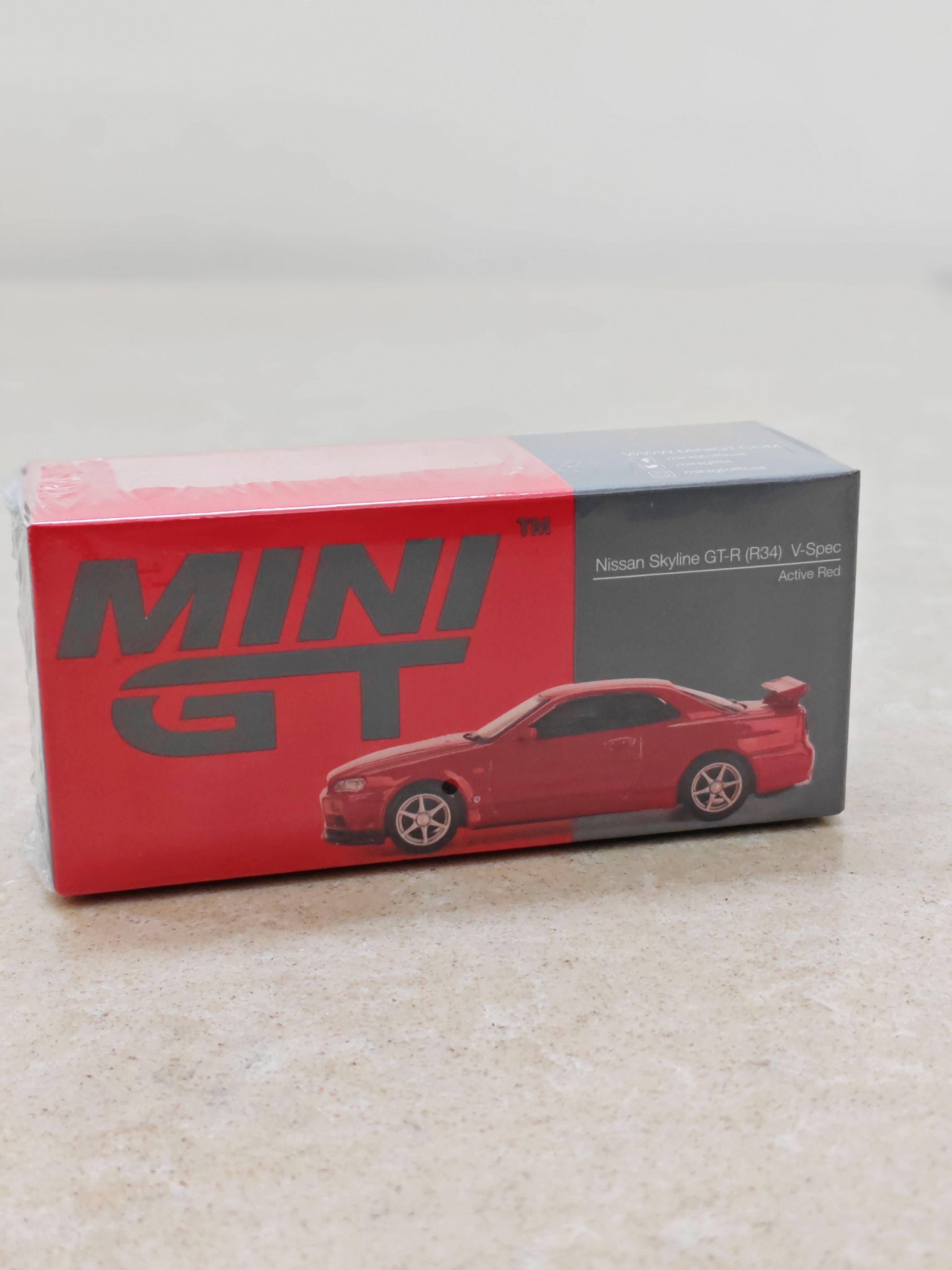 Mini GT Nissan Skyline GT-R (R-34) V Spec Active Red Diecast Car 1:64 Scale